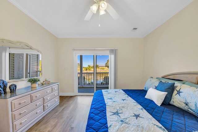 bedroom featuring access to exterior, visible vents, light wood-style flooring, and crown molding