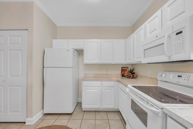 kitchen with white cabinetry, white appliances, light tile patterned floors, and light countertops