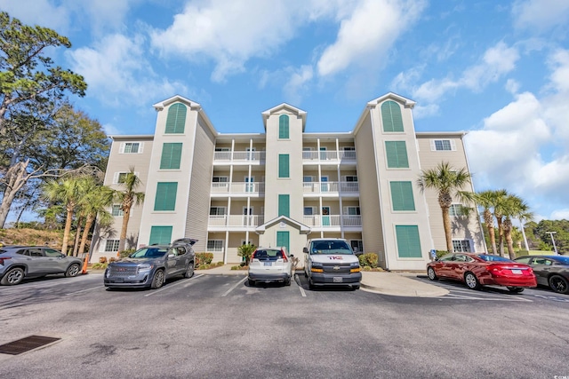 view of property with uncovered parking