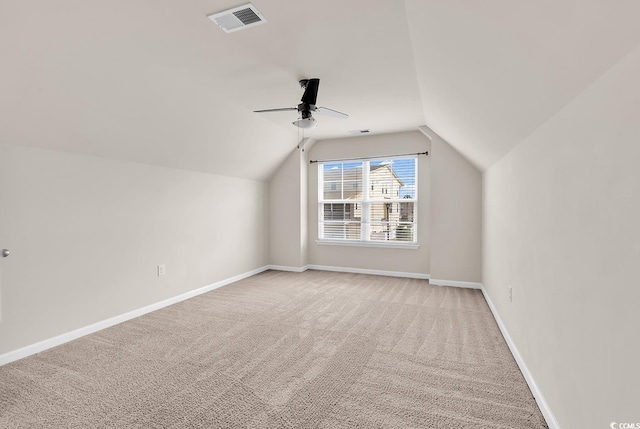 bonus room featuring vaulted ceiling, carpet flooring, visible vents, and baseboards