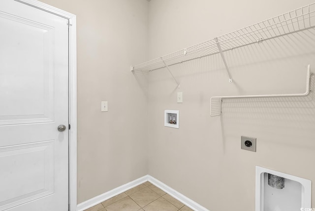 laundry room with laundry area, light tile patterned floors, baseboards, hookup for an electric dryer, and washer hookup