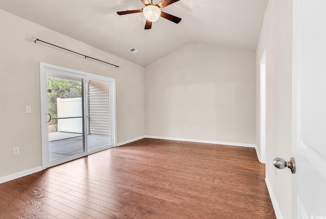 unfurnished room featuring visible vents, ceiling fan, vaulted ceiling, wood finished floors, and baseboards