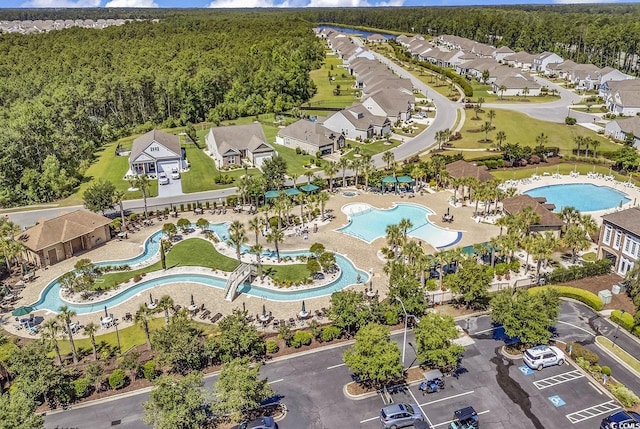 aerial view with a residential view and a wooded view