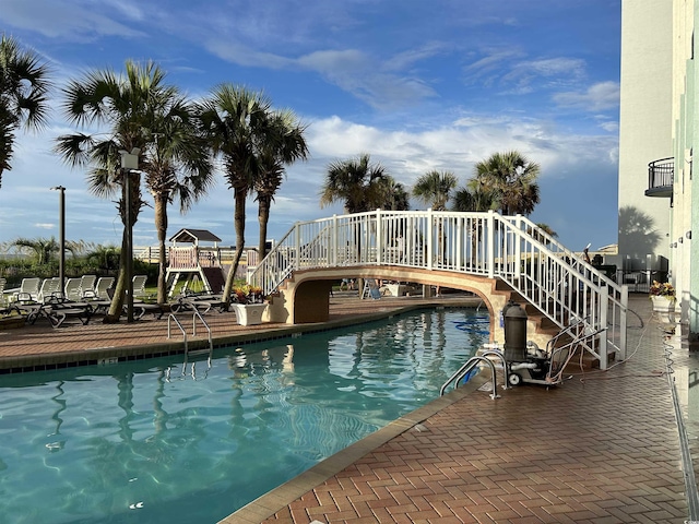 view of pool featuring stairs