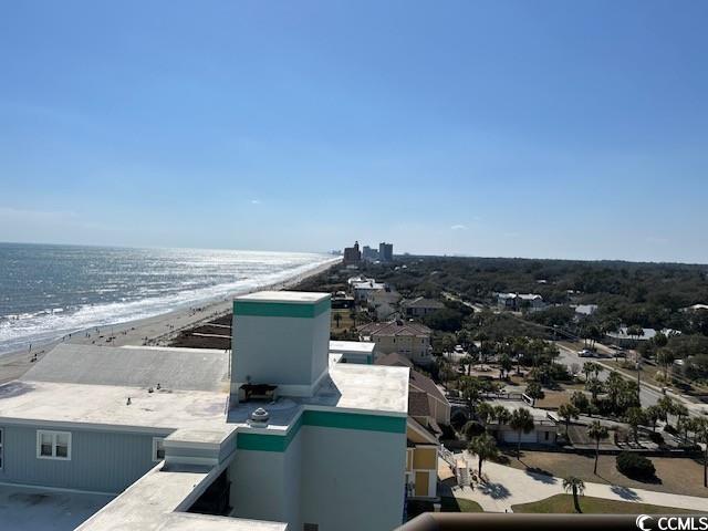 bird's eye view with a water view and a beach view