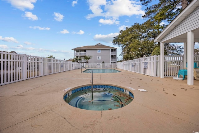 4430 Eastport Blvd Unit L5, Little River, SC 29566 - community pool with a patio area, a hot tub, and fence