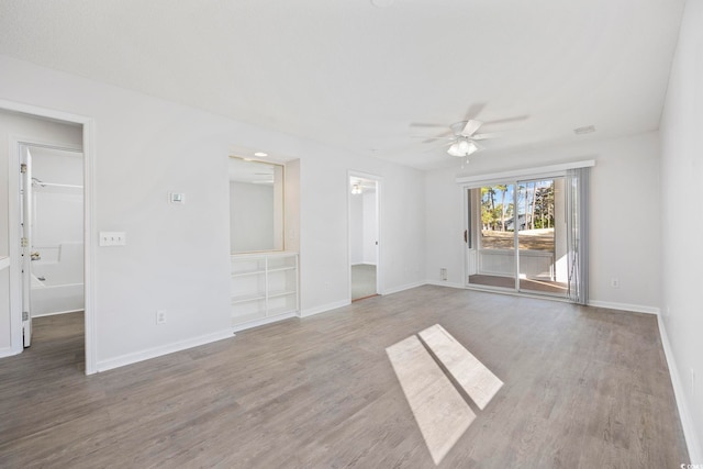 4430 Eastport Blvd Unit L5, Little River, SC 29566 - empty room with wood finished floors, visible vents, baseboards, and ceiling fan