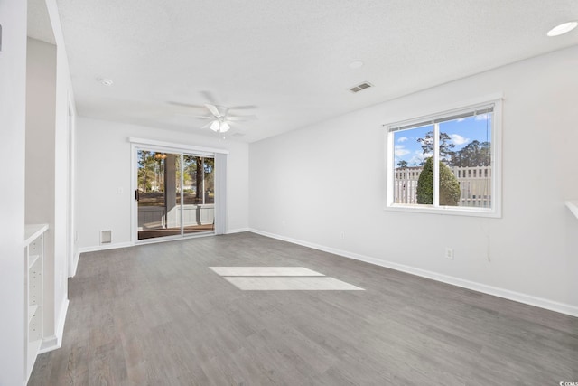 4430 Eastport Blvd Unit L5, Little River, SC 29566 - spare room featuring baseboards, wood finished floors, visible vents, and ceiling fan