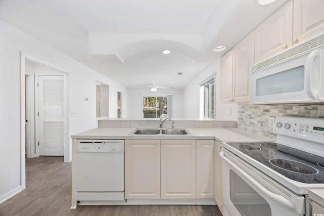 4430 Eastport Blvd Unit L5, Little River, SC 29566 - kitchen with tasteful backsplash, a sink, white appliances, light countertops, and a peninsula