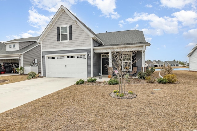 1881 Moonseed Dr, Longs, SC 29568 - craftsman house featuring driveway, covered porch, an attached garage, a shingled roof, and a front lawn
