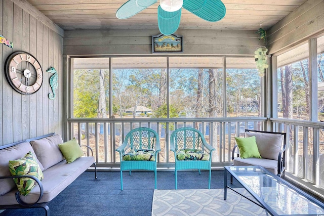 unfurnished sunroom with wooden ceiling and a ceiling fan