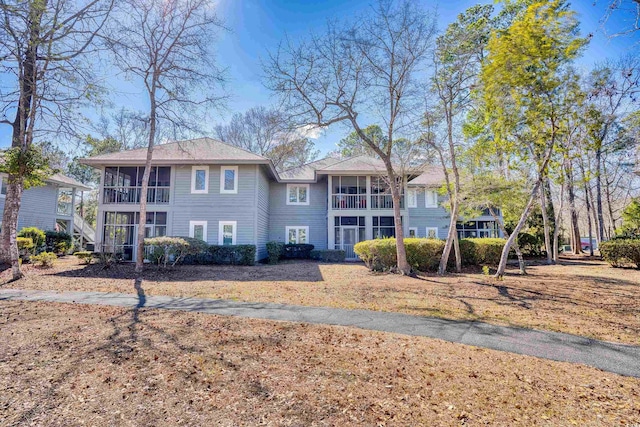 view of front of property featuring a sunroom