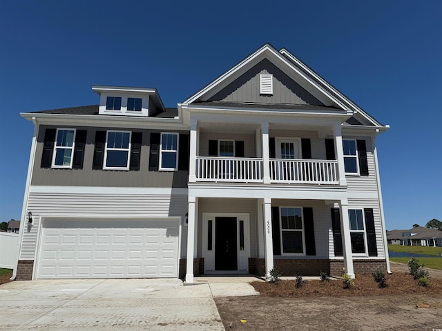 4008 Bucolic Loop, Myrtle Beach, SC 29588 - view of front facade featuring a balcony, a porch, concrete driveway, and an attached garage