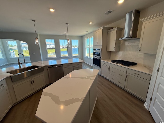 4008 Bucolic Loop, Myrtle Beach, SC 29588 - kitchen featuring wall chimney exhaust hood, gas stovetop, a sink, dishwashing machine, and dark wood finished floors