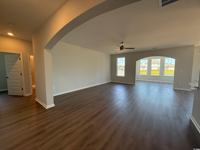 4008 Bucolic Loop, Myrtle Beach, SC 29588 - unfurnished living room featuring arched walkways, ceiling fan, dark wood finished floors, baseboards, and recessed lighting