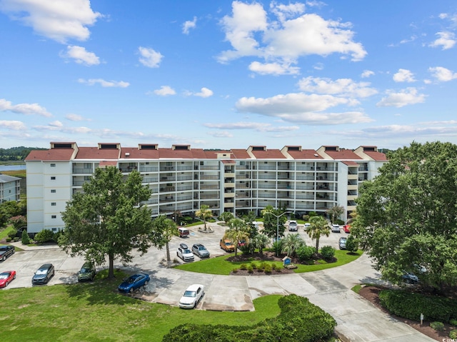 view of property featuring uncovered parking