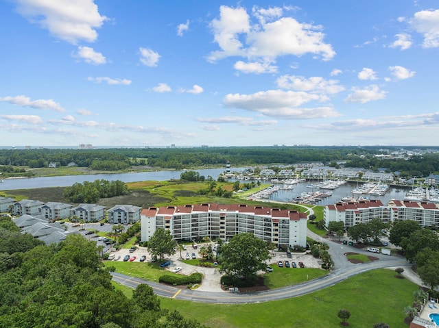 birds eye view of property with a water view