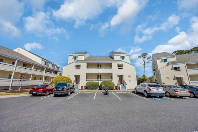 view of property with uncovered parking