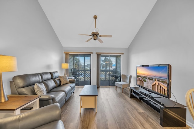 living room featuring high vaulted ceiling, a ceiling fan, and wood finished floors