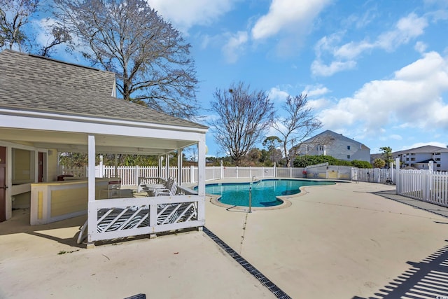 pool featuring a patio and a fenced backyard