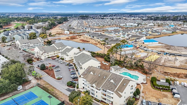 drone / aerial view with a residential view and a water view