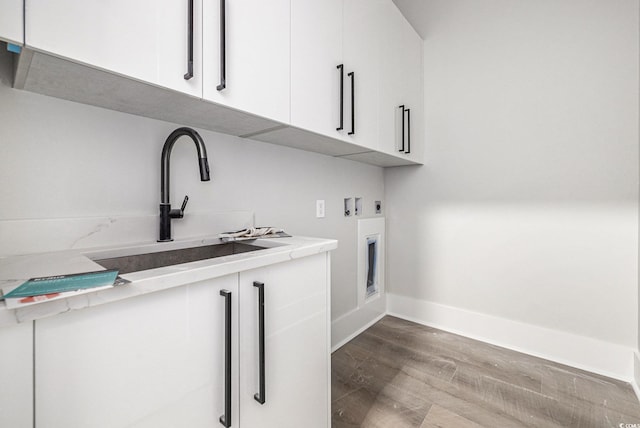 1217 Bentcreek Ln, Myrtle Beach, SC 29579 - washroom with cabinet space, hookup for an electric dryer, wood finished floors, hookup for a washing machine, and baseboards