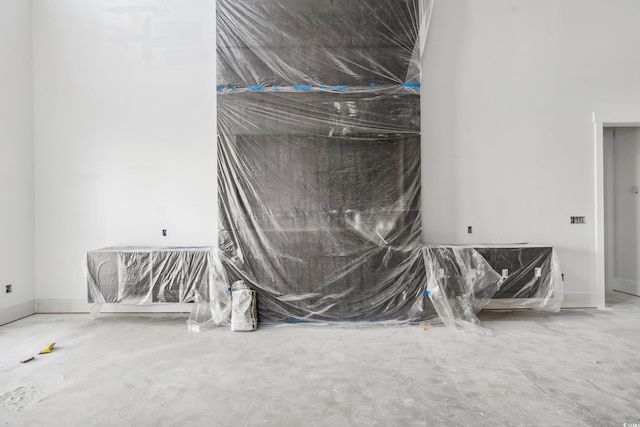 unfurnished room featuring concrete flooring