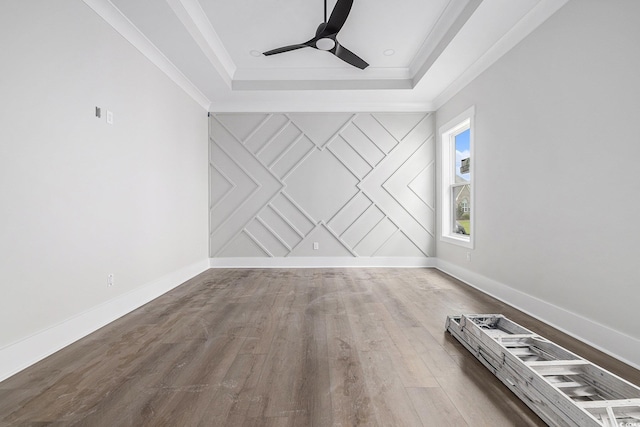 1217 Bentcreek Ln, Myrtle Beach, SC 29579 - unfurnished room featuring a raised ceiling, a ceiling fan, wood finished floors, baseboards, and ornamental molding