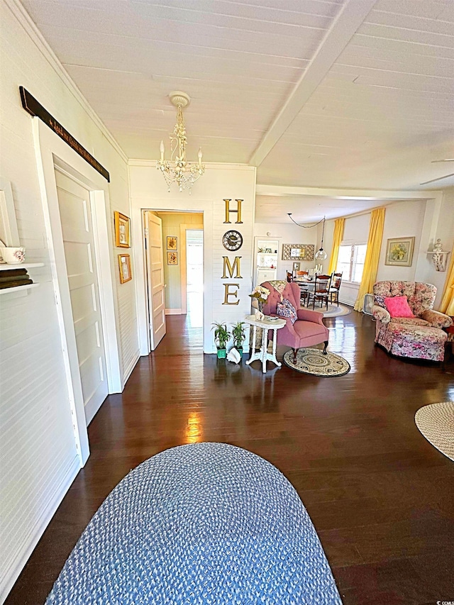 corridor featuring crown molding, a notable chandelier, beamed ceiling, and wood finished floors