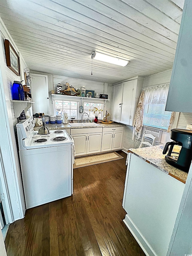 kitchen featuring a sink, white cabinetry, light countertops, white range with electric cooktop, and dark wood finished floors