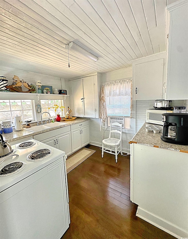 kitchen with white appliances, wood ceiling, dark wood-type flooring, white cabinetry, and a sink