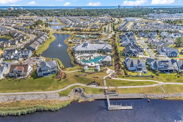 bird's eye view featuring a water view and a residential view