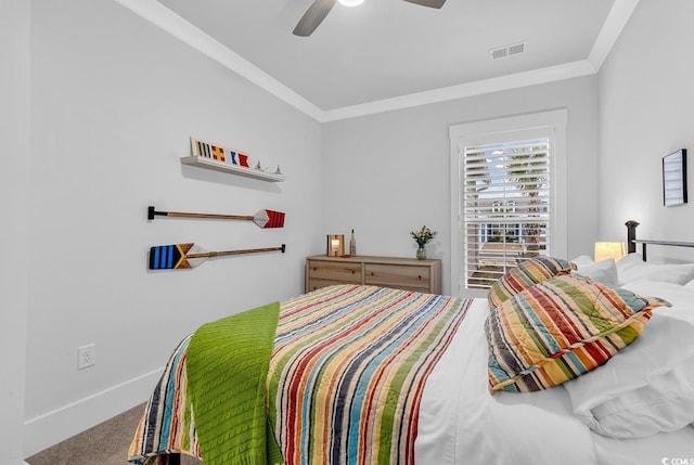 bedroom with carpet, visible vents, baseboards, ceiling fan, and crown molding