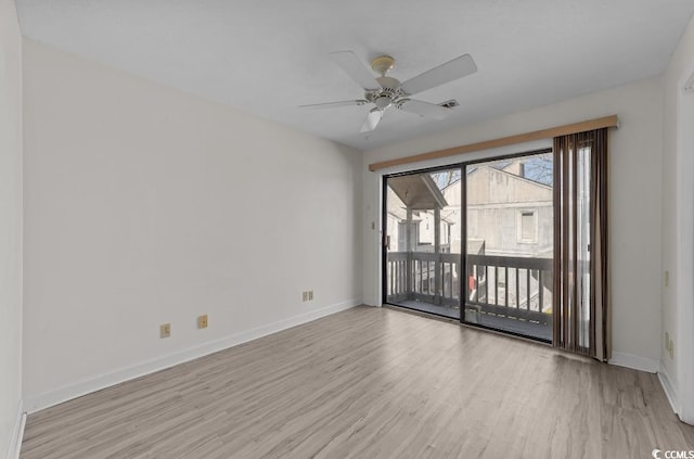 unfurnished room featuring visible vents, wood finished floors, baseboards, and ceiling fan