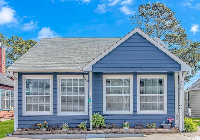 view of front of house with roof with shingles