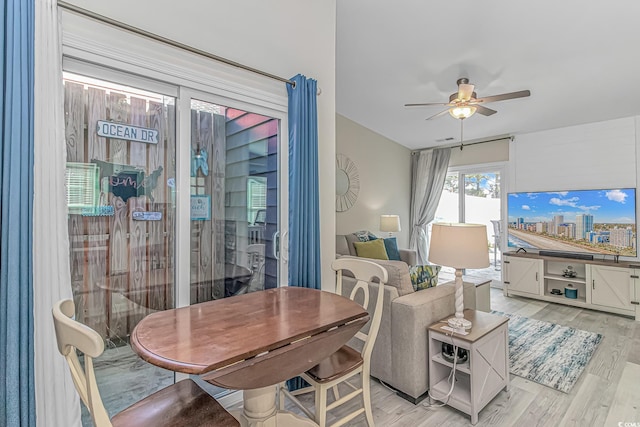 interior space featuring light wood finished floors, visible vents, and a ceiling fan