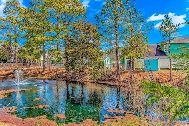 water view featuring fence