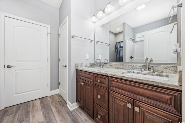 108 Silver Peak Dr, Conway, SC 29526 - bathroom with double vanity, wood finished floors, and baseboards