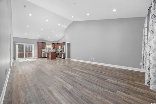 108 Silver Peak Dr, Conway, SC 29526 - unfurnished living room featuring high vaulted ceiling, wood finished floors, baseboards, and recessed lighting