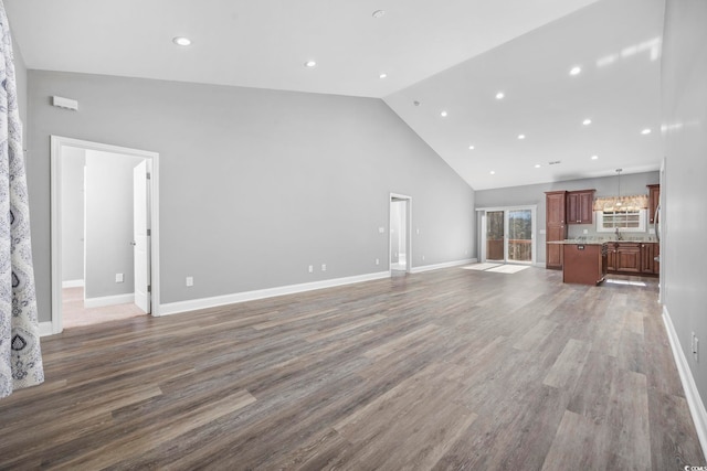 108 Silver Peak Dr, Conway, SC 29526 - unfurnished living room featuring high vaulted ceiling, wood finished floors, recessed lighting, and baseboards