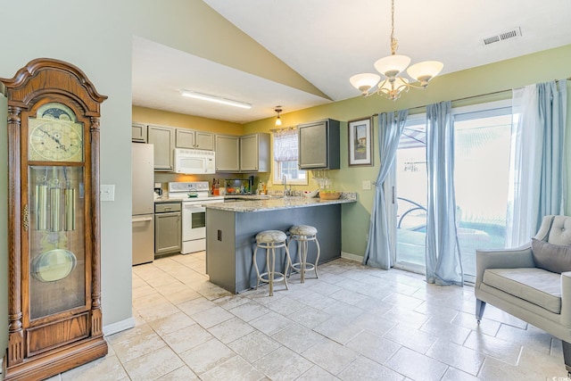 kitchen with visible vents, gray cabinetry, white appliances, and a notable chandelier