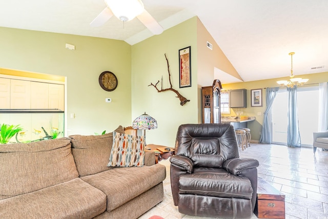 living area with high vaulted ceiling, visible vents, and ceiling fan with notable chandelier