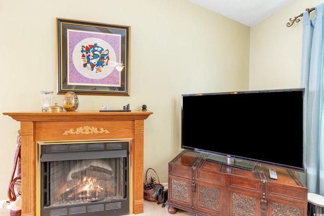 interior details featuring a warm lit fireplace