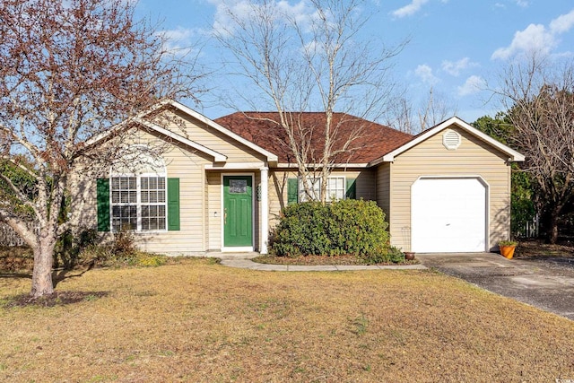 single story home with an attached garage, a front yard, and aphalt driveway