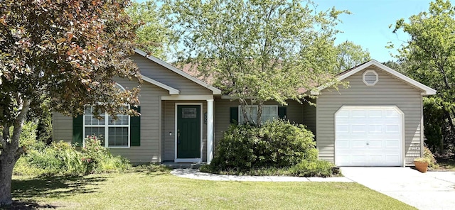 view of front of property featuring an attached garage, a front lawn, and driveway