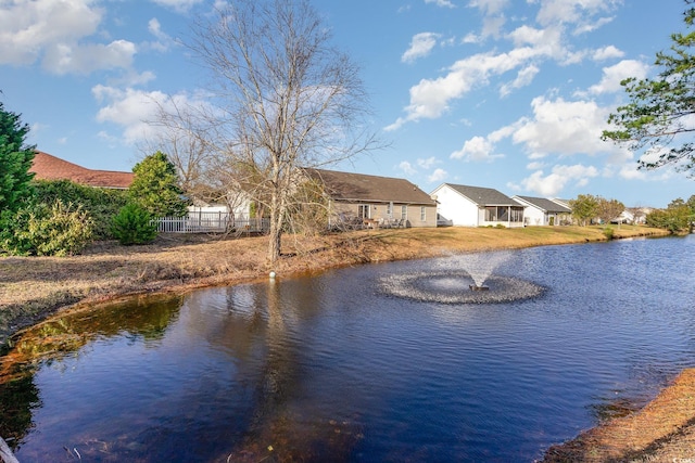 view of water feature featuring fence and a residential view