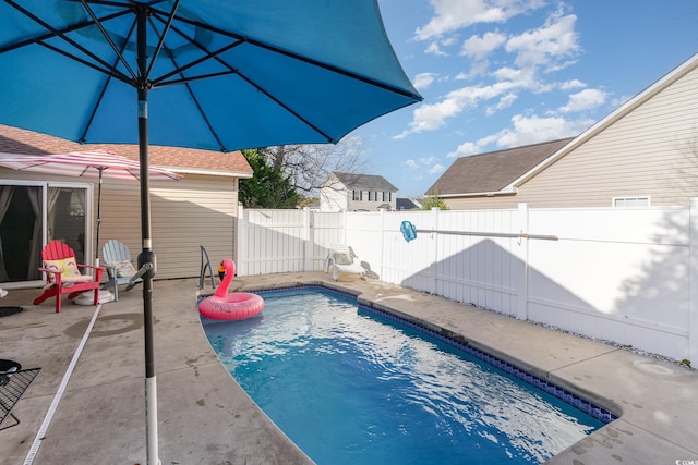 view of pool with a fenced in pool, a patio, and a fenced backyard