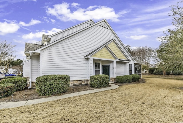 view of home's exterior featuring a yard