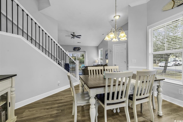 dining area with baseboards, wood finished floors, stairs, and ceiling fan with notable chandelier