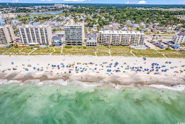 bird's eye view with a view of city, a view of the beach, and a water view